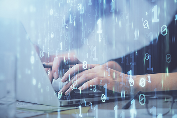 Decorative image showing feminine hands typing on a laptop with a matrix-like overlay